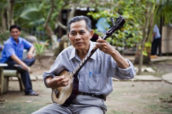 Musicien, delta du Mekong, Vietnam